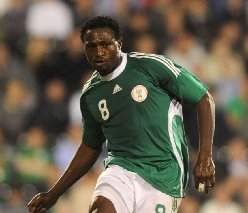 Soccer player in a green Nigeria style jersey with number 8 sprinting on the field amid a blurred crowd  trybalnews