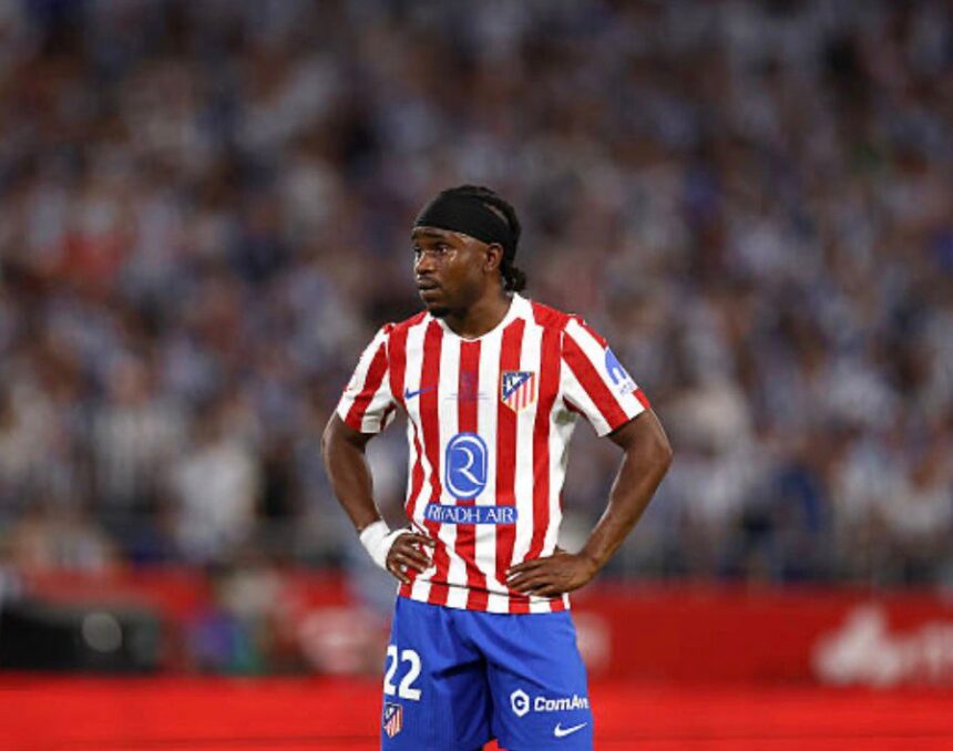Atlético Madrid footballer wearing the red and white striped jersey hands on hips during a match  trybalnews
