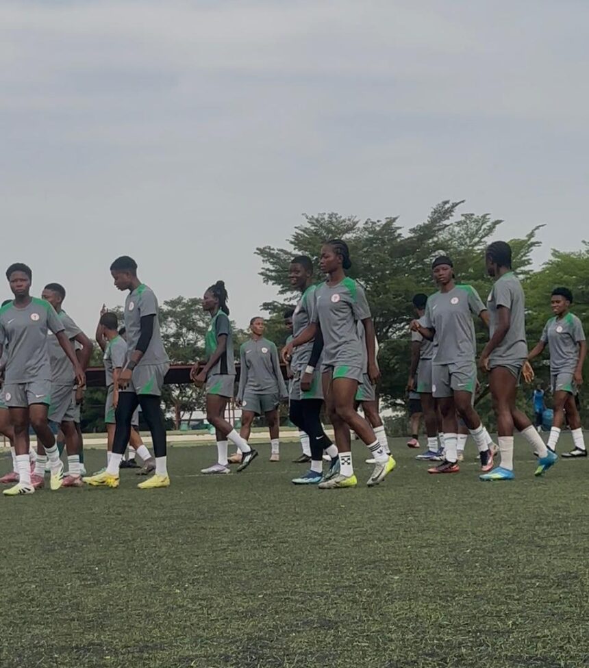 A group of young soccer players in gray uniforms walking in a line on a turf field during practice  trybalnews