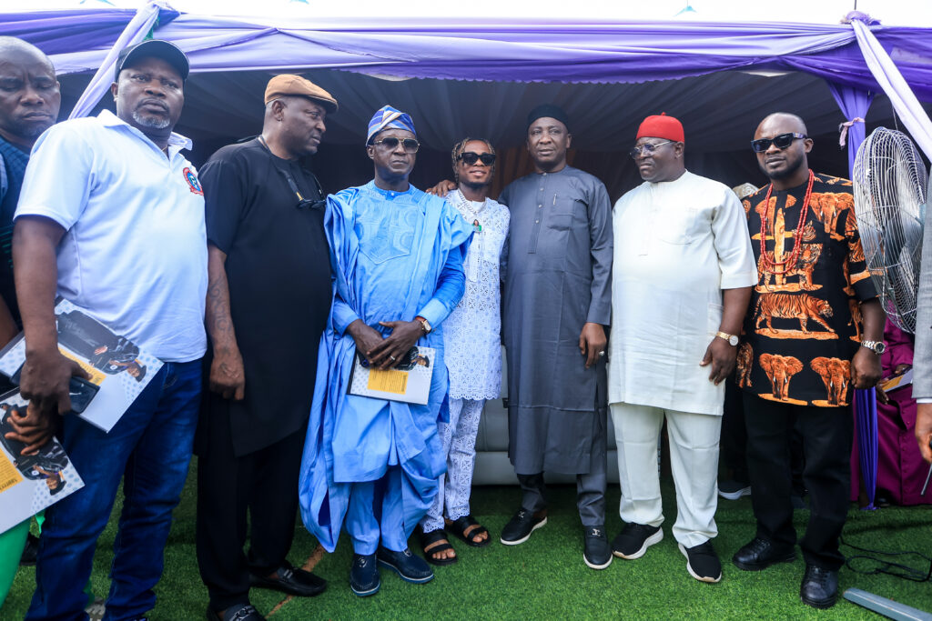 Ikorodu City vs Enugu Rangers Nigeria Premier Football League Lagos State Nigeria Trybal News Group of men in traditional and smart casual attire posing together at an outdoor event under a purple canopy trybalnews