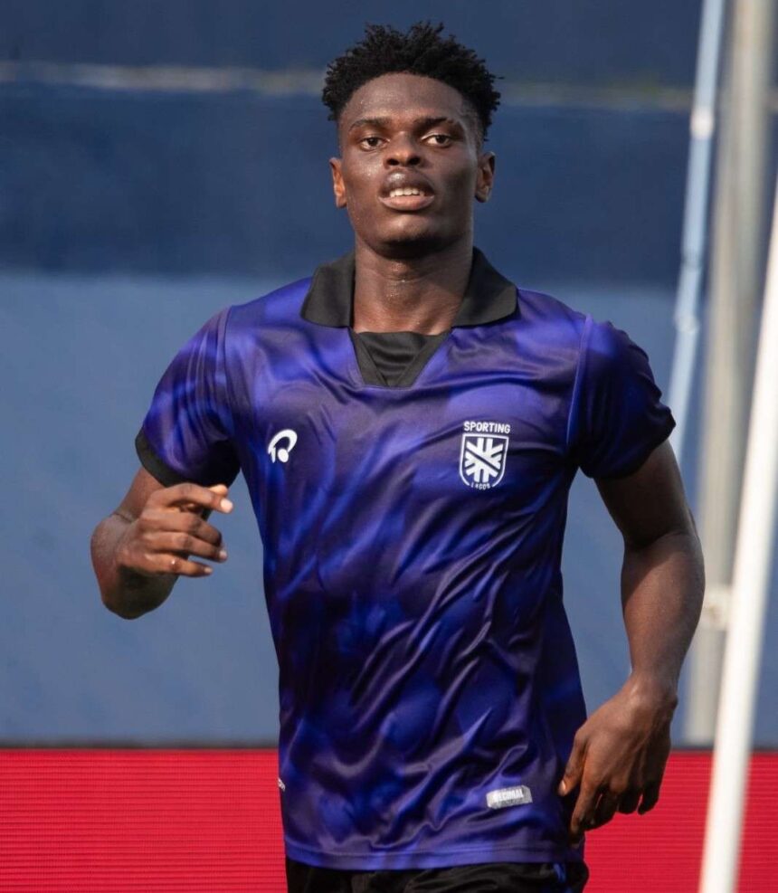 Male athlete in a blue gradient soccer jersey runs forward on a field Sporting crest visible on chest  trybalnews