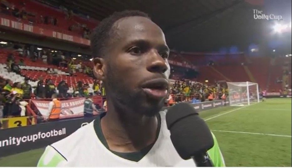 AlhassanYusuf Trybal News Footballer being interviewed on the field microphone held close with stadium stands and fans behind trybalnews