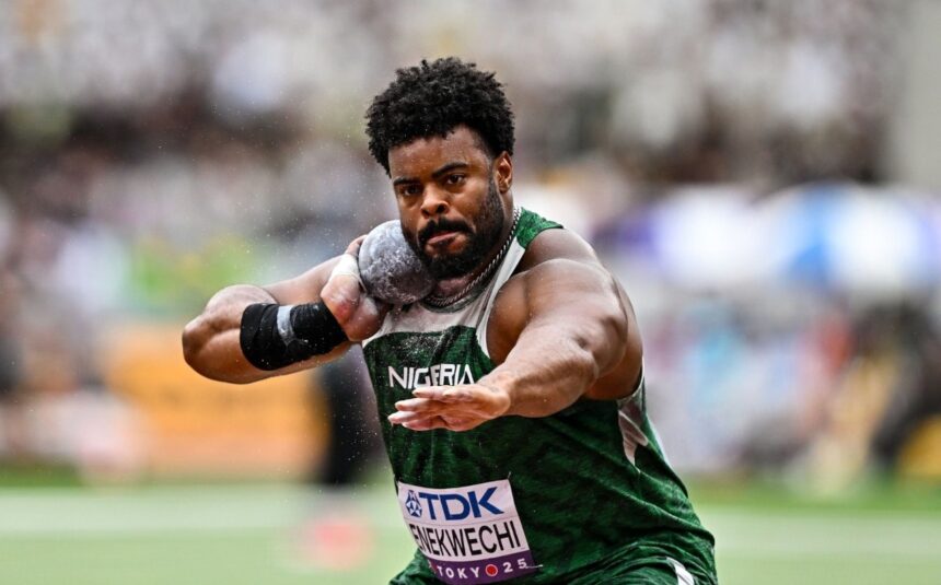 Nigerian male shot put athlete in green uniform throwing a shot put during a competition with a blurred stadium crowd in the background  trybalnews