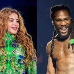 Shakira and Burna Boy on stage in different shows smiling a smiling woman with long curly hair wearing a vivid green patterned jacket beside a shirtless man with dreadlocks laughing and holding a green microphone  trybalnews