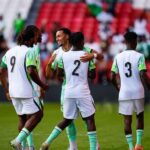 Group of soccer players in white and green uniforms celebrate on a green pitch with numbers 9 2 and 3 on their backs  trybalnews