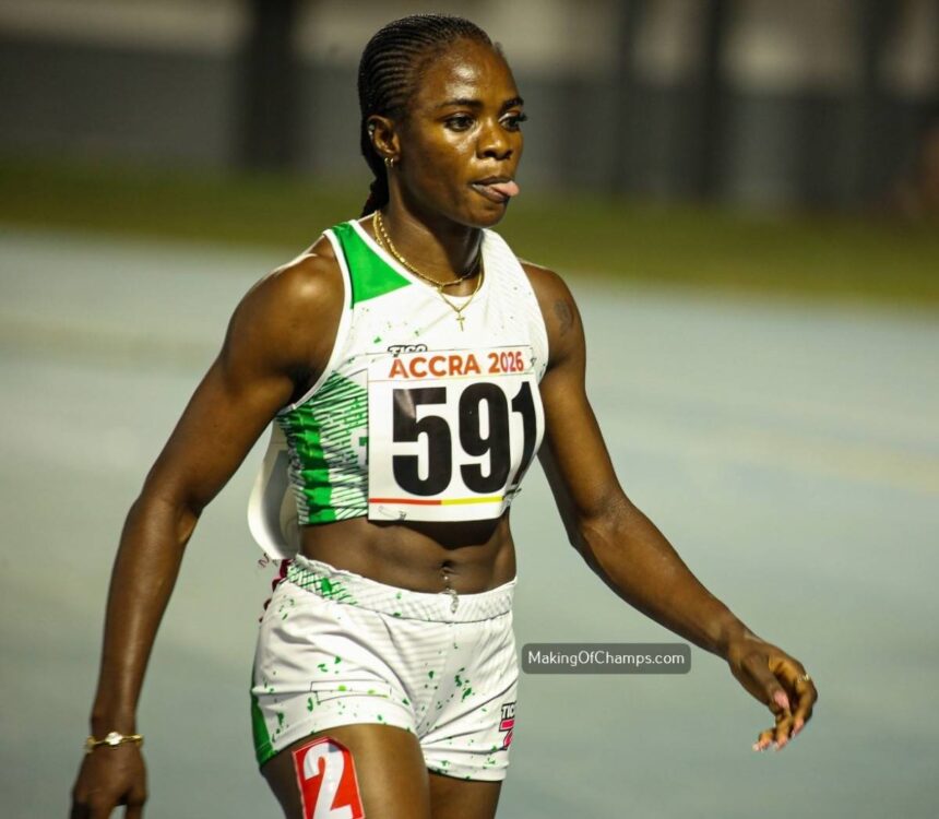 Female sprinter in a white and green athletic outfit with bib ACCRA 2026 and number 591 walking on a track after a race  trybalnews