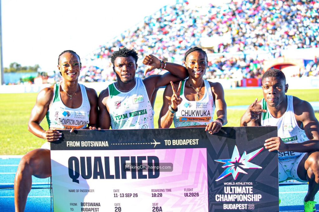 WhatsApp Image 20260503 at 183821 Trybal News Four athletes pose with a large QUALIFIED sign and travelcompetition banner at a stadium crowd behind them celebrating trybalnews