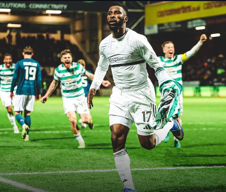 Soccer player in a white kit number 17 runs toward the camera as teammates celebrate in the background on a green pitch  trybalnews
