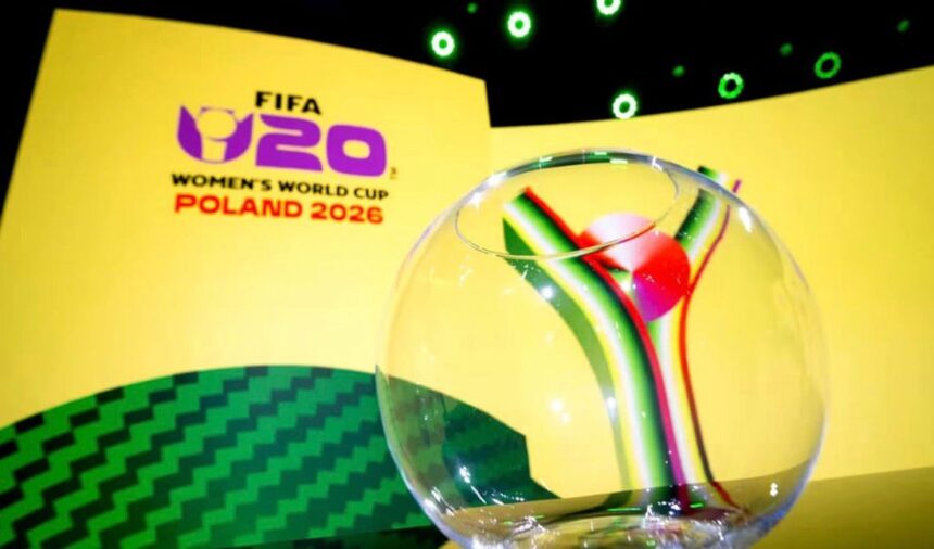 Branding for FIFA Womens World Cup Poland 2026 with a glass globe in the foreground on a yellow stage backdrop  trybalnews