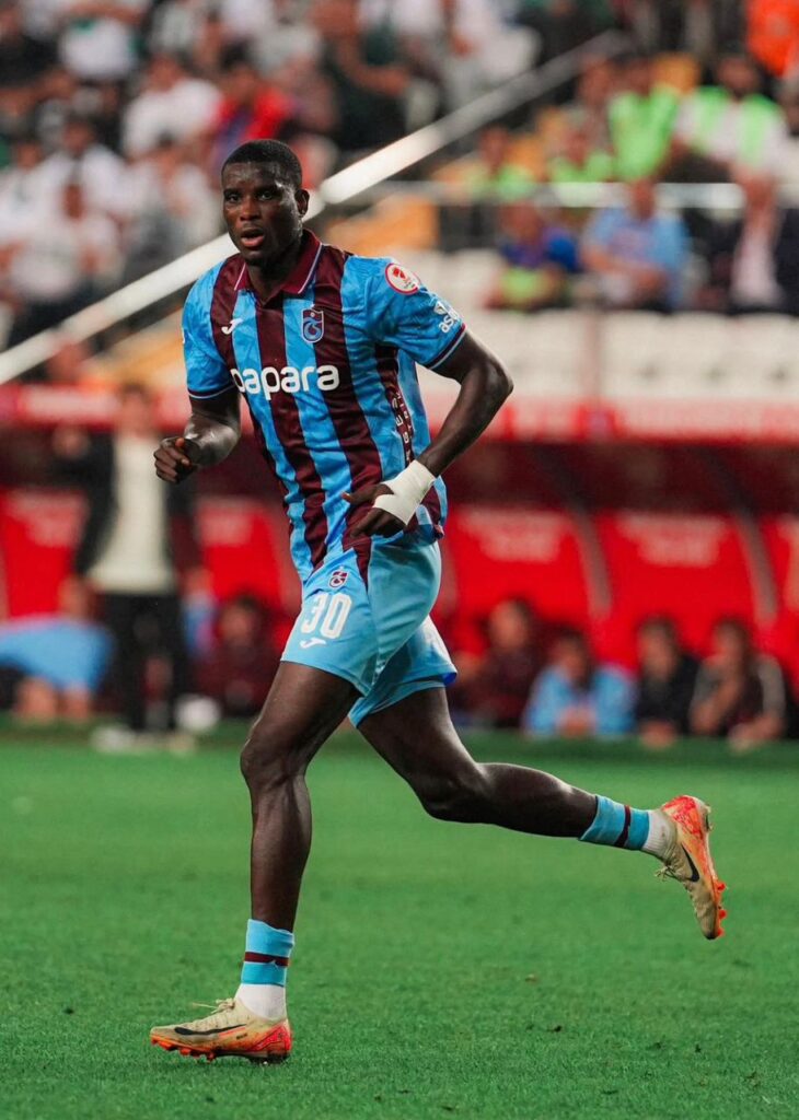 WhatsApp Image 20260522 at 213737 Trybal News Soccer player wearing a blue and maroon striped jersey with number 30 running on a green pitch during a match trybalnews