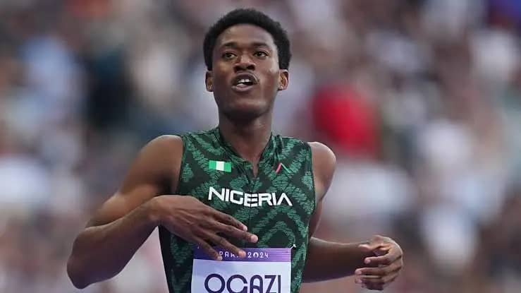 WhatsApp Image 20260525 at 165745 Trybal News Nigerian sprinter in a green jersey racing on a track with a blurred stadium crowd behind trybalnews