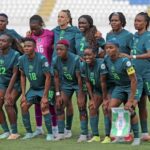 Nigeria womens national football team posing for a group photo on the soccer field in teal uniforms  trybalnews