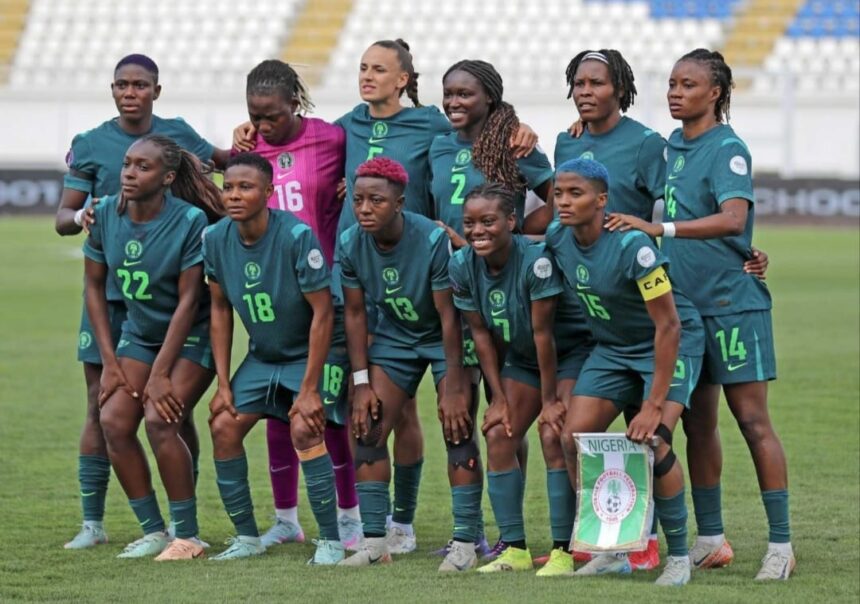Nigeria womens national football team posing for a group photo on the soccer field in teal uniforms  trybalnews