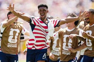 USA's Alex Freeman celebrates with teammates after scoring vs Australia, FIFA World Cup 2026 Group D at Seattle Stadium.