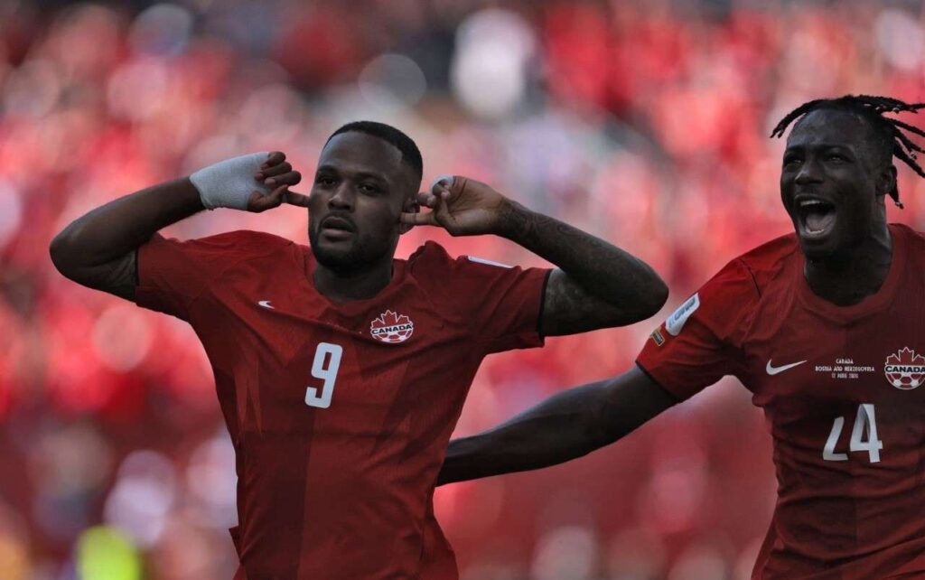 Canada Forward Cyle Larin Trybal News Canada trybalnews's forward Cyle Larin (L) celebrates after scoring a goal during the 2026 World Cup Group B football match between Canada and Bosnia and Herzegovina at the Toronto Stadium.