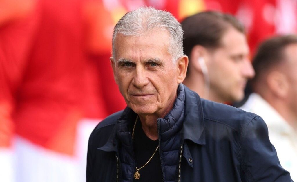 CarlosQueiroz Trybal News Ghana head coach Carlos Queiroz stands on the sideline wearing a dark suit and looks on during an international friendly match between Wales and Ghana at Cardiff City Stadium in Cardiff Wales on June 2 2026 trybalnews