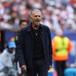 Ghana head coach Carlos Queiroz stands on the sideline wearing a navy jacket and black shirt with a gold necklace He appears to be shouting instructions with an intense expression during the FIFA World Cup 2026 Group L match between England and Ghana at Boston Stadium Foxborough Massachusetts on June 23 2026 Blurred crowd and stadium staff visible in background  trybalnews
