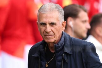 Ghana head coach Carlos Queiroz stands on the sideline wearing a dark suit and looks on during an international friendly match between Wales and Ghana at Cardiff City Stadium in Cardiff, Wales on June 2, 2026.