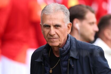 Ghana head coach Carlos Queiroz stands on the sideline wearing a dark suit and looks on during an international friendly match between Wales and Ghana at Cardiff City Stadium in Cardiff, Wales on June 2, 2026.