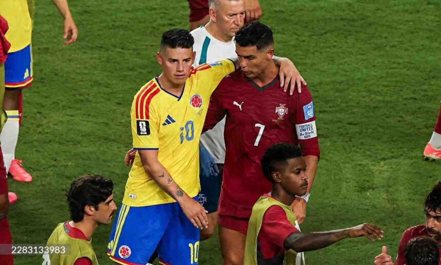 Colombia midfielder James Rodriguez wearing a yellow kit with number 10 and blue shorts stands next to Portugal forward Cristiano Ronaldo wearing a red kit with number 7 Rodriguez has his arm around Ronaldos shoulder in a post match moment A staff in white and other players in training bibs are visible on the green pitch The 2026 FIFA World Cup Group K match between Colombia and Portugal took place on June 27 2026 at Miami Stadium in Miami United States  trybalnews