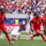 Switzerland forward Johan Manzambi celebrates after scoring his teams first goal during the FIFA World Cup 2026 Group B match between Switzerland and Bosnia and Herzegovina at Los Angeles Stadium in Inglewood California on June 18 2026 Manzambi wears a red Switzerland kit with white socks and pink boots arms outstretched as he runs  trybalnews