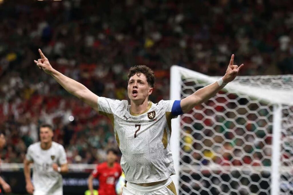 LadislavKrejci Trybal News Ladislav Krejci with number 7 in a white kit raises both arms in celebration near the goal in match versus South Korea trybalnews