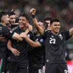Mexico soccer players in black jerseys celebrate together on the field Luis Romo wearing 7 is at the center smiling as teammates surround him with arms raised after scoring Mexicos first goal vs South Korea Korea at Guadalajara Stadium during the 2026 FIFA World Cup June 18 2026  trybalnews