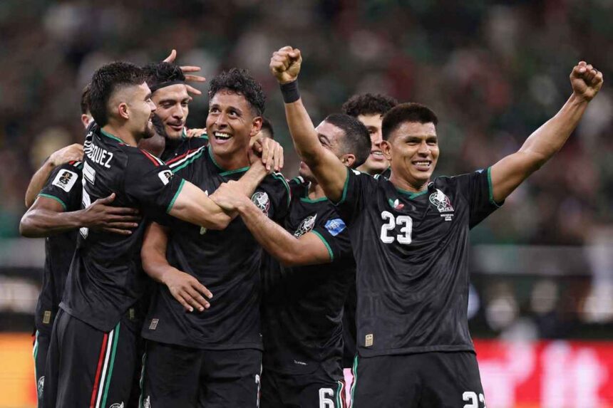 Mexico soccer players in black jerseys celebrate together on the field Luis Romo wearing 7 is at the center smiling as teammates surround him with arms raised after scoring Mexicos first goal vs South Korea Korea at Guadalajara Stadium during the 2026 FIFA World Cup June 18 2026  trybalnews