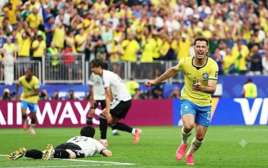 Brazil forward Gabriel Martinelli wearing a yellow 22 Brazil kit with blue shorts and pink cleats celebrates after scoring Brazils second goal He is running with arms outstretched and mouth open in celebration on the pitch Behind him two Japan players in white kits are dejected one lying on the grass and another running away The FIFA World Cup 2026 Round of 32 match between Brazil and Japan took place on June 29 2026 at Houston Stadium in Houston Texas A packed stadium of yellow clad Brazil fans cheers in the background with Qatar Airways hoardings visible around the pitch  trybalnews
