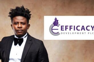 Portrait of a man in a black tuxedo and bow tie beside the EFFICIACY DEVELOPMENT PLC logo on a white panel.