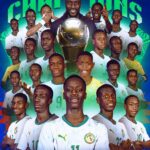 Senegal U 17 football team players pose with a large trophy and the word Champions in the background celebrating the CAF U 17 Africa Cup of Nations 2017  trybalnews