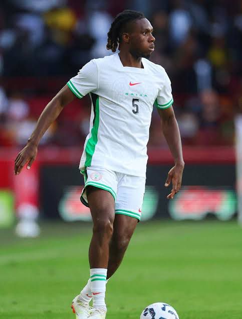 Soccer player in a white Algeria kit with green trim number 5 on a grassy field during a match  trybalnews