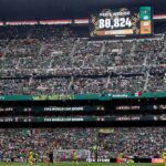 Crowd fills a large football stadium in Mexico City for a FIFA World Cup 2026 match with a scoreboard displaying attendance 80824 and Fuel House text  trybalnews