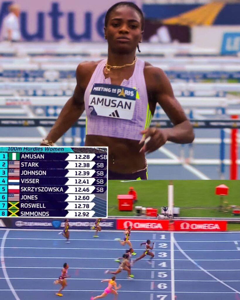 Tobi Amusan Trybal News Female sprinter in a lavender top running a 100m hurdles race bib reads AMUSAN with a timing board nearby trybalnews