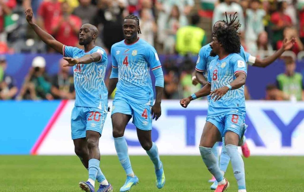 DR Congo forward Yoane Wissa celebrates with teammates after scoring DR Congos first goal in the FIFA World Cup 2026 Group K match against Portugal at Houston Stadium Houston Texas  trybalnews