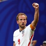 England captain Harry Kane wearing the 9 white home kit with an orange captains armband celebrates with a raised fist after scoring a goal to make the score 1 1 during the FIFA World Cup 2026 Round of 32 match against Congo DR at Atlanta Stadium in Atlanta United States on July 1 2026  trybalnews