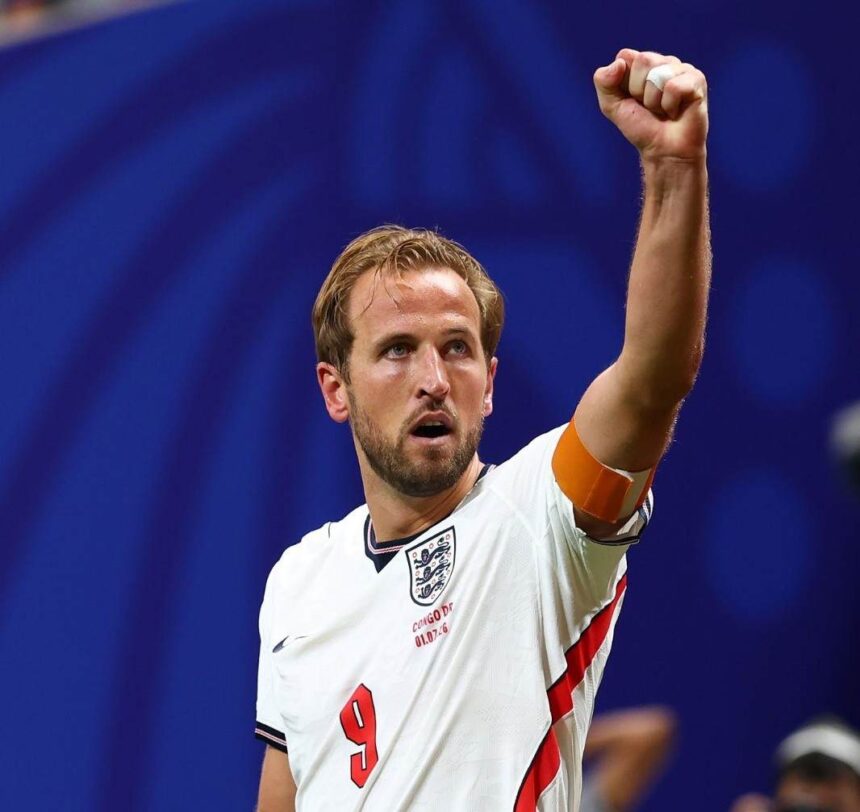 England captain Harry Kane wearing the 9 white home kit with an orange captains armband celebrates with a raised fist after scoring a goal to make the score 1 1 during the FIFA World Cup 2026 Round of 32 match against Congo DR at Atlanta Stadium in Atlanta United States on July 1 2026  trybalnews