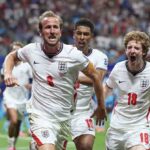 England forward Harry Kane wearing the 9 white kit and captains armband celebrates after scoring with teammates Jude Bellingham 10 and Anthony Gordon 18 during the FIFA World Cup 2026 Round of 32 match against Congo DR at Atlanta Stadium in Atlanta Georgia on July 1 2026  trybalnews