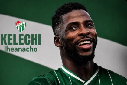 Portrait of Kelechi Iheanacho smiling in a green Bursaspor jersey with the team crest visible on the left.