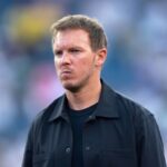 Julian Nagelsmann head coach of Germany stands on the sideline with a serious expression during the FIFA World Cup 2026 Round of 32 match between Germany and Paraguay at Boston Stadium in Foxborough Massachusetts on June 29 2026 He is wearing a black collared jacket over a black crew neck shirt looking to his left The background is a blurred stadium crowd Photo by Joe PriorVisionhaus via Getty Images  trybalnews