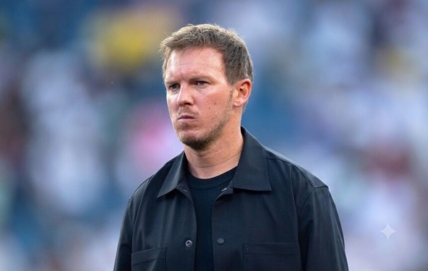 Julian Nagelsmann head coach of Germany stands on the sideline with a serious expression during the FIFA World Cup 2026 Round of 32 match between Germany and Paraguay at Boston Stadium in Foxborough Massachusetts on June 29 2026 He is wearing a black collared jacket over a black crew neck shirt looking to his left The background is a blurred stadium crowd Photo by Joe PriorVisionhaus via Getty Images  trybalnews