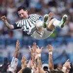 Lionel Messi wearing Argentinas blue and white striped 10 jersey is lifted into the air by teammates after Argentinas 3 2 victory over Egypt in the FIFA World Cup 2026 Round of 16 at Atlanta Stadium in Atlanta Georgia on July 7 2026 Messi smiles with arms outstretched as multiple hands reach up to celebrate with him in front of a blurred stadium crowd  trybalnews