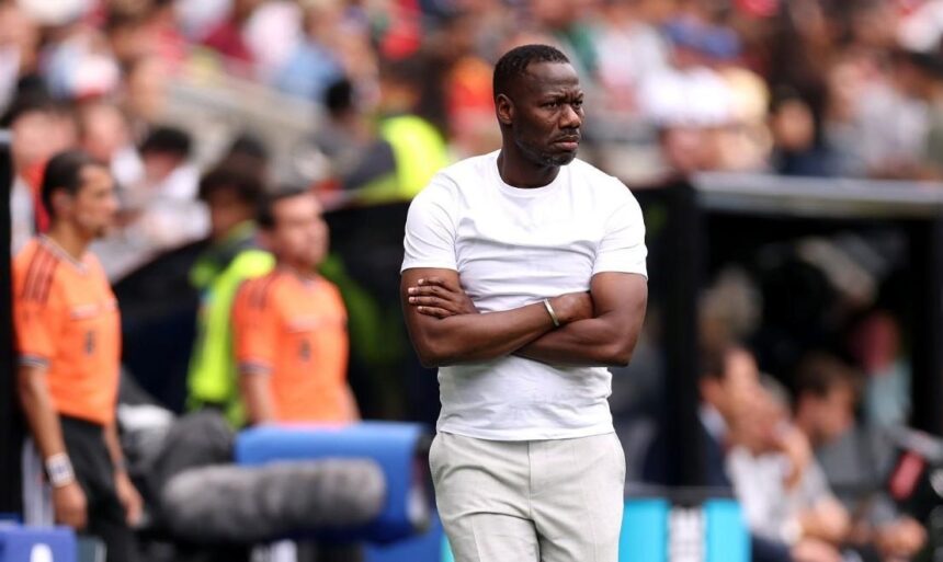 Senegal head coach Pape Thiaw stands on the touchline with his arms crossed looking intently toward the pitch during the FIFA World Cup 2026 Round of 32 match between Belgium and Senegal at Seattle Stadium in Seattle Washington on July 1 2026  trybalnews
