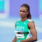 Nigerian female sprinter in green and white kit on a track bib reads GEORGE looking focused  trybalnews