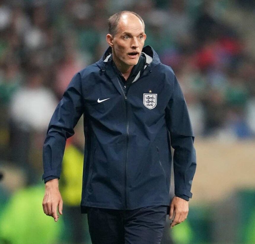 England head coach Thomas Tuchel stands on the touchline wearing a navy blue England training jacket with the Three Lions crest He looks focused during the FIFA World Cup Round of 16 match at Mexico City Stadium on Sunday July 5 2026 Stadium crowd and green seating are blurred in the background  trybalnews