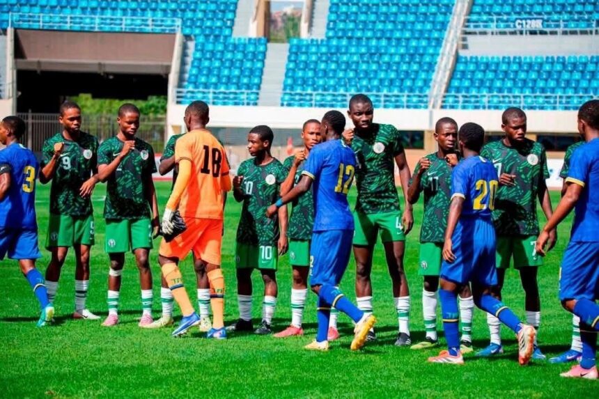 Soccer players in green uniforms line up to shake hands with blue team players before kickoff on a sunny stadium field  trybalnews