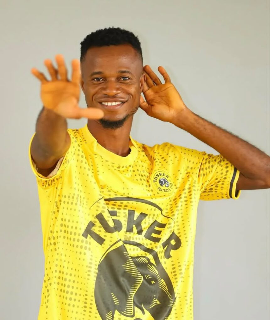 Smiling man in a bright yellow sports jersey cupping his hand to his ear as if listening intentively  trybalnews