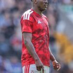 Soccer player in a red Nottingham Forest kit standing on the pitch  trybalnews