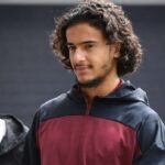 Ayyoub Bouaddi of Lille OSC walks with a maroon and navy training jacket featuring the New Balance logo and LOSC Lille crest ahead of the Ligue 1 McDonalds match between Angers and Lille at Stade Raymond Kopa on August 23 2026 in Angers France  trybalnews