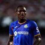 Close up shot of Getafe CF footballer Chrisantus Uche looking ahead on the pitch while wearing a blue home kit during a LaLiga match  trybalnews
